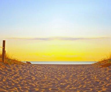 Path on the sand going to the ocean in Miami Beach Florida at sunrise or sunset, beautiful nature landscape, retro instagram filter for vintage looks